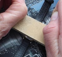 Closing a snap back watch case